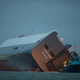 Illustration for article titled These Photos Of That Grounded Car Carrier Ship Are Beautifully Surreal